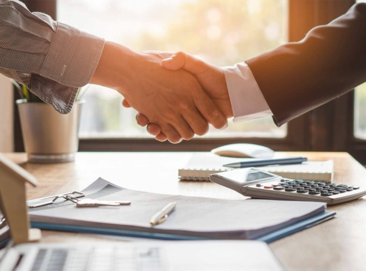 Interior designer working on home design plans with client